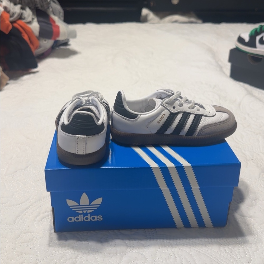 Adidas White and Black Sneakers with Signature Stripes